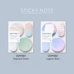 Two packages of COFFRET cosmetic motif sticky notes in Peacock Green and Lagoon Blue on a light blue background.